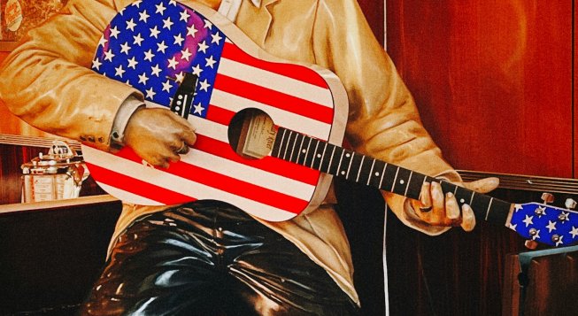 Chitarra a stelle e strisce © Unsplash / Jon Tyson