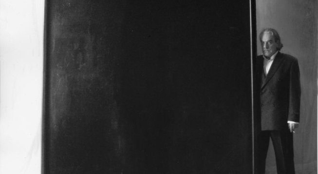 Thierry De Cordier posing next to a large Nada painting Auvergne, 1999